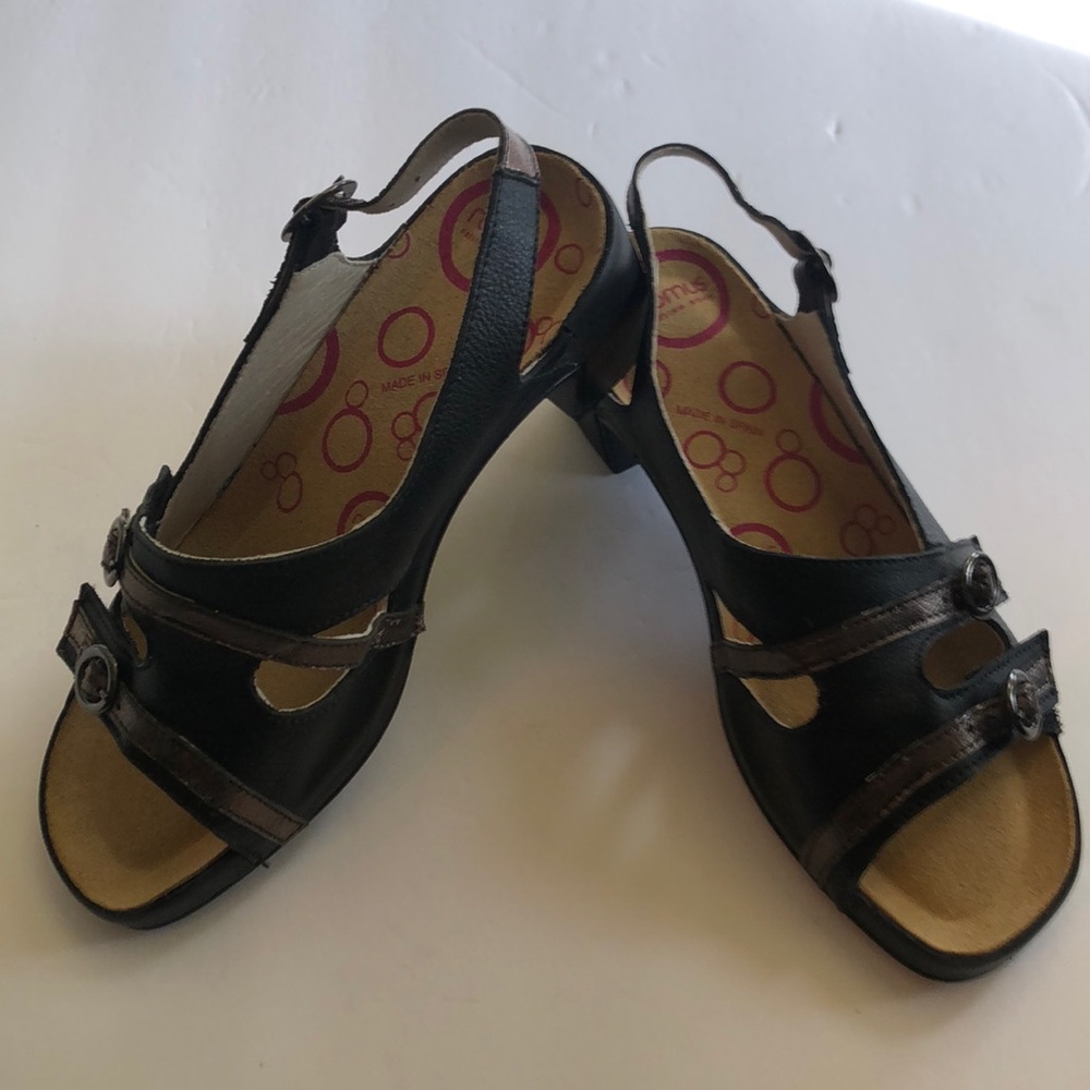 Never worn. Romus black sandals with bronze adjustable straps.Size 36.